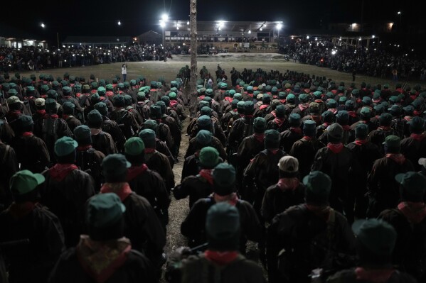 Members of the Zapatista National Liberation Army, EZLN, attend an event marking the 30th anniversary of the Zapatista uprising in Dolores Hidalgo, Chiapas, Mexico, Sunday, Dec. 31, 2023. (AP Photo/Eduardo Verdugo)