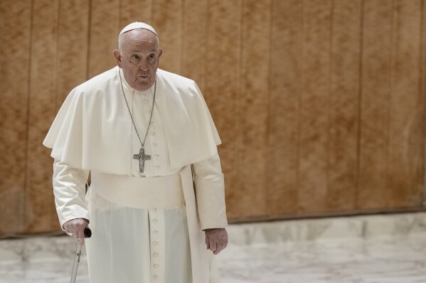 Pope Francis arrives for his weekly general audience in the Pope Paul VI hall at the Vatican, Wednesday, Dec. 6, 2023. (AP Photo/Andrew Medichini)