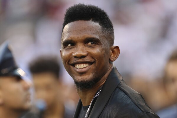 FILE - Soccer player Samuel Eto'o watches warmups before an International Champions Cup soccer match between Atletico Madrid and Real Madrid, July 26, 2019, in East Rutherford, N.J. Eto’o, president of the Cameroon soccer federation, is being investigated by the Confederation of African Football for alleged “improper conduct." The former Barcelona and Inter Milan forward was elected to a four-year term in December 2021 but the initial euphoria that greeted his reforms is giving way to accusations of clientelism and unfulfilled financial promises to clubs. (AP Photo/Steve Luciano, File)
