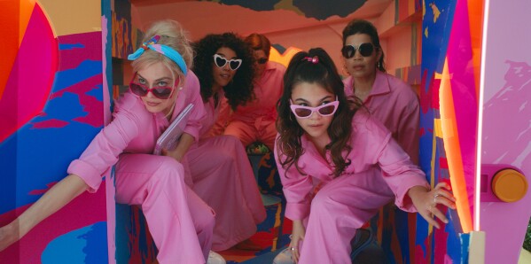 This image released by Warner Bros. Pictures shows Margot Robbie, from left, Alexandra Shipp, Michael Cera, Ariana Greenblatt and America Ferrera in a scene from "Barbie." (Warner Bros. Pictures via AP)