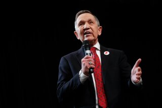 FILE - In this April 10, 2018, file photo, former U.S. Rep. Dennis Kucinich, of Ohio speaks during the Ohio Democratic Party's fifth debate in the primary race for governor at Miami (OH) University's Middletown campus in Middletown, Ohio. Kucinich is returning a $20,000 speaking fee he received last year from a group sympathetic to Syrian President Bashar Assad. The Democratic candidate for Ohio governor announced his decision in a letter sent Thursday, April 26, 2018, to The Plain Dealer. (AP Photo/John Minchillo, File)