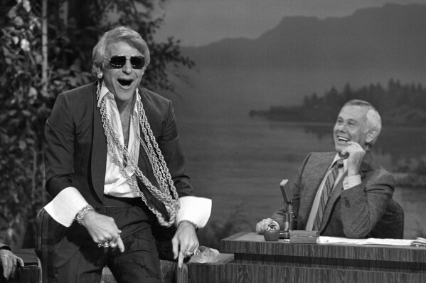 FILE - Comedian Steve Martin left, appears with host Johnny Carson during an appearance on "The Tonight Show Starring Johnny Carson" in Burbank Calif., July 19, 1980. Martin is the subject of a new documentary "Steve! (Martin) a Documentary in 2 Pieces." (AP Photo/Lennox McLendon, File)