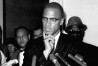 FILE - Malcolm X speaks to reporters in Washington on May 16, 1963. The city of New York is settling lawsuits filed on behalf of two men who were exonerated in 2021 for the 1965 assassination of Malcolm X, agreeing to pay $26 million for the wrongful convictions which led to both men spending decades behind bars, according to attorneys for the men Sunday, Oct. 30, 2022. (APPhoto/File)