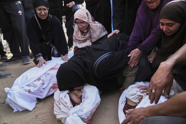 Palestinians mourn children from their families who were killed in Israeli airstrikes in Jabalia, in the northern Gaza Strip, on Wednesday, May 14, 2025. According to local hospitals, the strikes killed 48 people, including 22 children. (AP Photo/Jehad Alshrafi)
