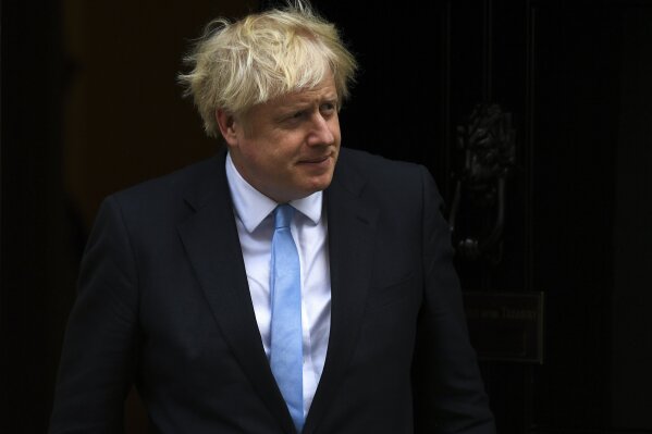 Britain's Prime Minister Boris Johnson walks out 10 Downing Street to greet the US Vice President Mike Pence, in London, Thursday, Sept. 5, 2019.(AP Photo/Alberto Pezzali)