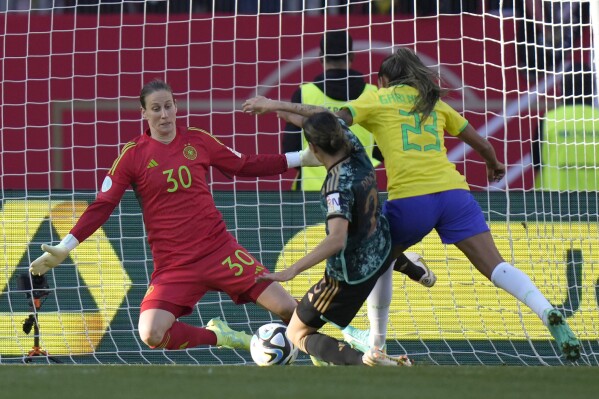 FILE - Germany's goalkeeper Ann-Katrin Berger saves a shot by Brazil's Gabriela Nunes during the women's international soccer friendly match between Germany and Brazil, at the Max Morlock stadium in Nuremberg, Germany, Tuesday, April 11, 2023. Defending champion NJ/NY Gotham FC has acquired German international goalkeeper Ann-Katrin Berger from Chelsea FC Women in exchange for an undisclosed transfer fee. Gotham announced the deal on Friday, April 19, 2024, noting Berger has signed a one-year contract through 2024, with an option for the 2025 National Women’s Soccer League season.(AP Photo/Matthias Schrader, File)