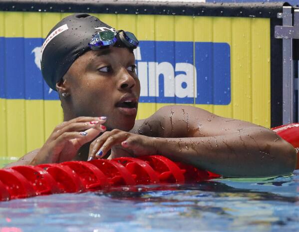 FILE - In this July 28, 2019, file photo, United States' Simone Manuel reacts after winning the women's 50-meter freestyle final at the World Swimming Championships in Gwangju, South Korea. Manuel is working to make swimming more diverse and change the perception that it’s for whites only. (AP Photo/Lee Jin-man, File)