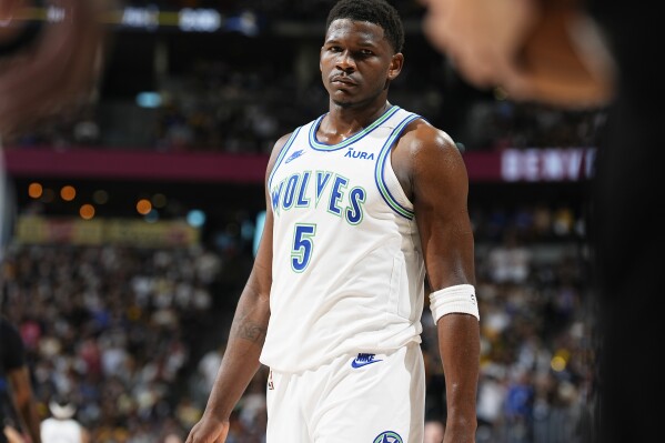 Minnesota Timberwolves guard Anthony Edwards waits for play to resume in the first half of Game 7 of an NBA second-round playoff series against the Denver Nuggets, Sunday, May 19, 2024, in Denver. (AP Photo/David Zalubowski)