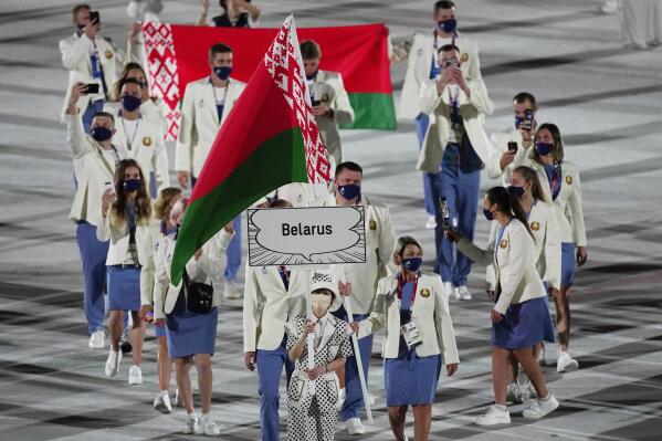 Athletes from Belarus walk during the opening ceremony in the Olympic Stadium at the 2020 Summer Olympics, Friday, July 23, 2021, in Tokyo, Japan. (AP Photo/David J. Phillip)