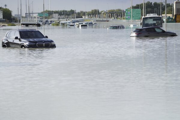 Dubai airport flooded and flights are hit as storm dumps record rain on UAE  | AP News