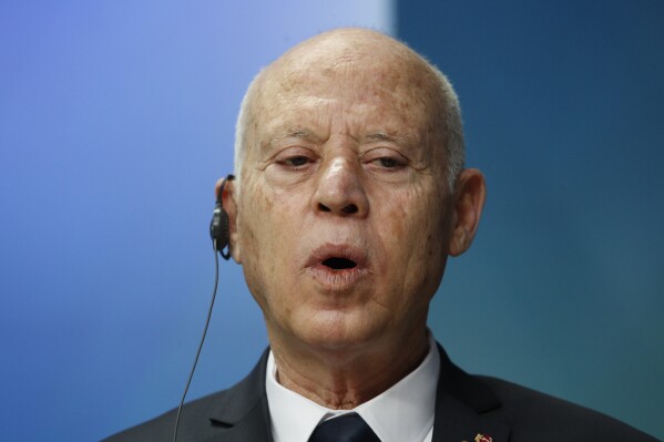 FILE - Tunisia's President Kais Saied speaks during a media conference at an EU Africa summit in Brussels, Friday, Feb. 18, 2022. Two Tunisian journalists are kept in pre-trial detention as authorities continued a wave of arrests targeting perceived critics of President Kais Saied's government. Borhen Bsaies and Mourad Zeghidi remain behind bars after being apprehended. They were accused of violating a cybercrime law against fake news. (Johanna Geron, Pool Photo via AP, File)