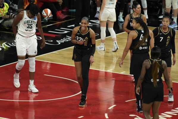 Las Vegas Aces forward A'ja Wilson (22) reacts after a play against the New York Liberty during the first half in Game 1 of a WNBA basketball final playoff series Sunday, Oct. 8, 2023, in Las Vegas. (AP Photo/John Locher)