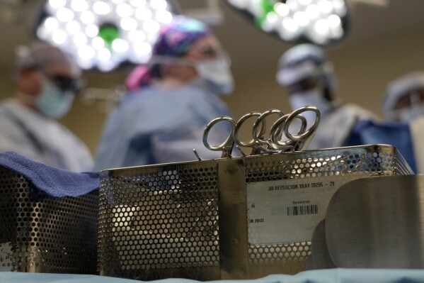 FILE - Instruments sit on a table in an operating room June 15, 2023, in Jackson, Tenn. Patients who take blockbuster drugs like Wegovy for weight loss may face life-threatening complications if they need surgery or other procedures that require empty stomachs for anesthesia. In June 2023, the American Society of Anesthesiologists issued guidance advising patients to skip daily weight-loss medications on the day of surgery and hold off on weekly injections for a week before any sedation procedures. (AP Photo/Mark Humphrey, File)