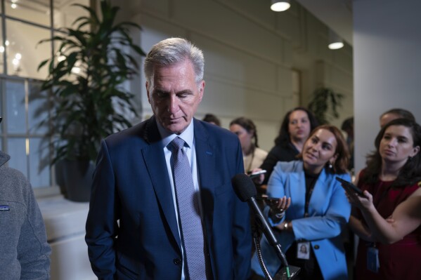 FILE - Speaker of the House Kevin McCarthy, R-Calif., briefs reporters following a closed-door Republican Conference meeting on how to agree on a path to funding the government, at the Capitol in Washington, Tuesday, Sept. 19, 2023. McCarthy has turned to a strategy that has so far preserved his tenuous hold on House leadership but also marked it by chaos. He is facing a fast-approaching government shutdown that threatens to disrupt life for millions of Americans. (AP Photo/J. Scott Applewhite, File)