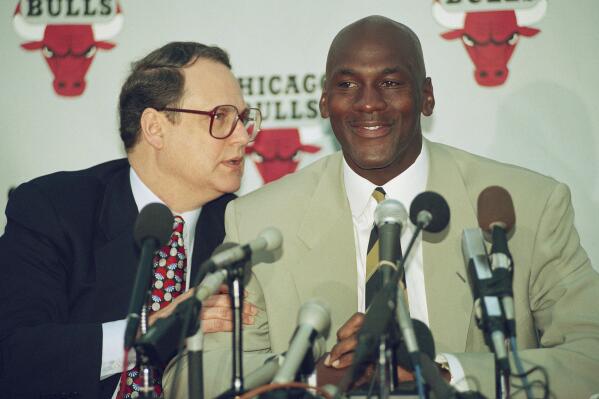 FILE - Chicago Bulls star Michael Jordan listens to team owner Jerry Reinsdorf during a news conference at the Berto Center in Deerfield, Ill., Oct. 6, 1993, where Jordan announced his retirement from professional basketball. (AP Photo/Mark Elias, File)