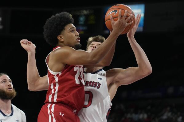 Wisconsin guard Chucky Hepburn (23) drives on St. Mary's center Mitchell Saxen in the first half during an NCAA college basketball game at the Maui Invitational in Las Vegas, Wednesday, Nov. 24, 2021. (AP Photo/Rick Scuteri)