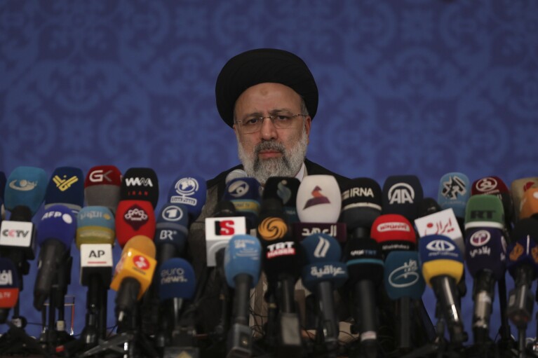 FILE - Iran's then-new President-elect Ebrahim Raisi speaks during a press conference in Tehran, Iran, June 21, 2021. Raisi, a hard-line protégé of the country's supreme leader who helped oversee the mass executions of thousands in 1988 and later led the country as it enriched uranium near weapons-grade levels and launched a major drone-and-missile attack on Israel, has died in a helicopter crash, according to state media on Monday, May 20, 2024. (AP Photo/Vahid Salemi, File)