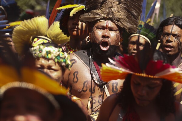 Indigenous groups gathering in Brazil’s capital to protest president’s land grant decisions