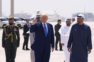 President Donald Trump gestures before departing on Air Force One at Abu Dhabi International Airport, Friday, May 16, 2025, in Abu Dhabi, United Arab Emirates. (AP Photo/Alex Brandon)