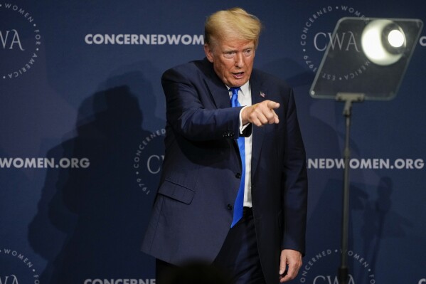 Former President Donald Trump points to the crowd after speaking at a Concerned Women for America Summit at the Capitol Hilton, Friday, Sept. 15, 2023, in Washington. (AP Photo/Andrew Harnik)