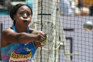 FILE - In this Sunday, May 21, 2017 file photo, Gwen Berry of the United States competes in the women's hammer throw at the Golden Grand Prix track and field event in Kawasaki, near Tokyo. The CEO of the U.S. Olympic and Paralympic Committee sent letters of reprimand to hammer thrower Gwen Berry and fencer Race Imboden for protesting on the medals stand last week at the Pan American Games, but the 12-month probations that came with the letters also included a none-too-subtle signal for anyone vying for next year's Olympics. (AP Photo/Shizuo Kambayashi, File)