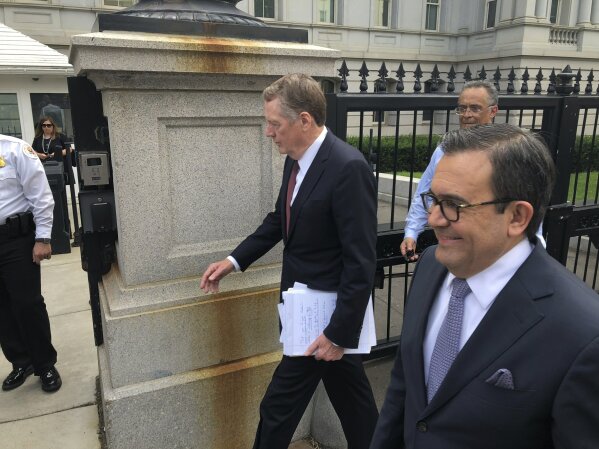 
              United States Trade Representative Robert Lighthizer, left, and Mexican Secretary of Economy Idelfonso Guajardo, right, walk into the White House on Monday August 27, 2018. President Donald Trump says the prospects are "looking good" for an agreement with Mexico that could set the stage for an overhaul of the North American Free Trade Agreement.  (AP Photo/Luis Alonso Lugo)
            