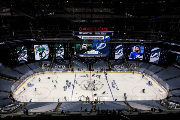 FILE -0 The Dallas Stars and the Tampa Bay Lightning warm up before the NHL hockey Stanley Cup Finals in Edmonton, Alberta, Saturday, Sept. 19, 2020. The Edmonton Oilers are in the Stanley Cup Final for the first time since 2006. But the NHL's championship series has been in the northern Alberta city much more recently. (Jason Franson/The Canadian Press via AP, File)