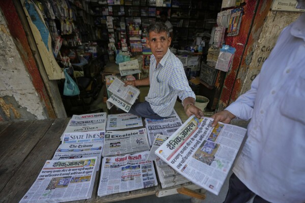 A vendor sells news papers after India Pakistan reported no incidents of firing overnight, at RS Pura, along the International Border, India, Monday, May 12, 2025. (AP Photo/Channi Anand)
