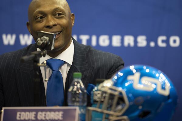 FILE - In this April 13, 2021, file photo, New Tennessee State University NCAA college football coach Eddie George smiles during a news conference in Nashville, Tenn.. George is one of several high-profile former pro athletes to take on athletic programs at black colleges and universities at a time when the country seems more than ready. (George Walker/The Tennessean via AP, File)