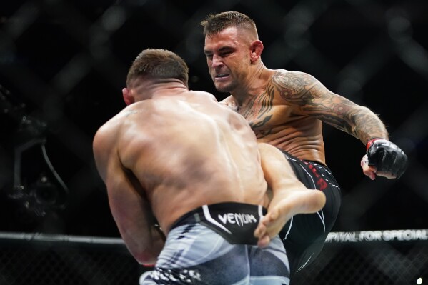 FILE - Dustin Poirier, right, kicks Michael Chandler during the first round of a lightweight bout in the UFC 281 mixed martial arts event, Saturday, Nov. 12, 2022 in New York. No. 2 ranked lightweight Poirier face No. 3 ranked Justin Gaethje for the so-called BMF title in Salt Lake City.(AP Photo/Frank Franklin II, FILE)