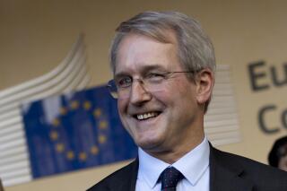 FILE - British lawmaker Owen Paterson outside the European Commission's headquarters in Brussels on Oct. 22, 2018. British lawmakers voted Wednesday Nov. 3, 2021, not to suspend Conservative legislator Owen Paterson who was found to have broken lobbying rules — a decision that instantly brought accusations of corruption from opponents of the Conservative government. (AP Photo/Francisco Seco, File)