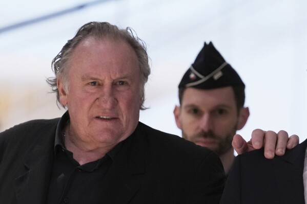Actor Gerard Depardieu arrives to face trial for the alleged sexual assaults of two women on a film set in 2021, on March 24, 2025 in Paris. (AP Photo/Aurelien Morissard, File)