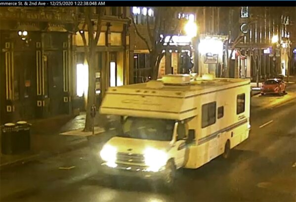 This image taken from surveillance video provided by Metro Nashville PD shows a recreational vehicle that was involved in a blast on Friday, Dec. 25, 2020 in Nashville, Tenn.  An explosion shook the largely deserted streets early Christmas morning, shattering windows, damaging buildings and wounding some people. Police were responding to a report of shots fired when they encountered a recreational vehicle blaring a recording that said a bomb would detonate in 15 minutes, Metro Nashville Police Chief John Drake said. Police evacuated nearby buildings and called in the bomb squad.  (Metro Nashville PD via AP)