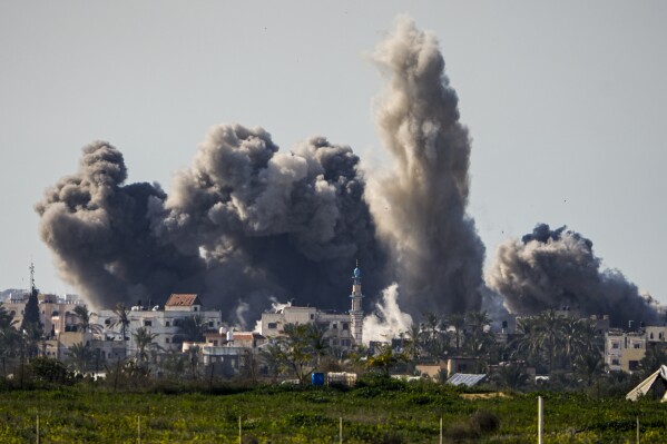 Smoke and explosion after an Israeli bombardment in the Gaza Strip, seen from southern Israel, Sunday, February 11, 2024. The army is fighting Palestinian militants across Gaza in the war sparked by Hamas' attack on Israel on October 7.  (AP Photo/Ariel Schalit)