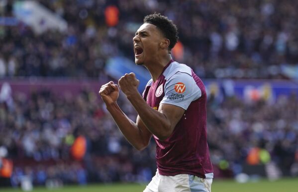 Aston Villa's Ollie Watkins celebrates after team-mate Moussa Diaby scores their second goal of the game during the English Premier League soccer match between Bournemouth and Aston Villa at Villa Park stadium in Birmingham, England, Sunday April 21, 2024. (David Davies/PA via AP)