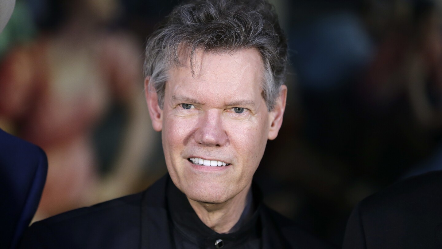 FILE - Randy Travis attends the announcement of the Country Music Hall of Fame inductees in Nashville, Tenn., on March 29, 2016. (AP Photo/Mark Humphr