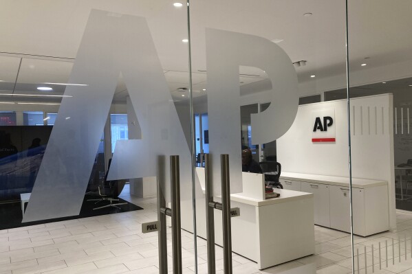 FILE - The Associated Press logo is shown at the entrance to the news organization's office in New York on Thursday, July 13, 2023. The Associated Press has issued guidelines for its journalists on use of artificial intelligence, saying the tool cannot be used to create publishable content and images for the news service. (AP Photo/Aaron Jackson, File