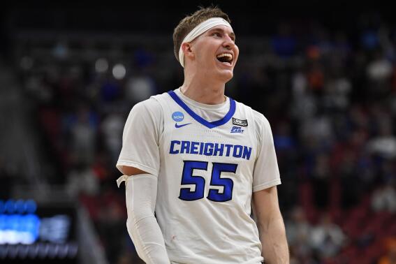 Creighton guard Baylor Scheierman (55) celebrates victory over Princeton after a Sweet 16 round college basketball game in the South Regional of the NCAA Tournament, Friday, March 24, 2023, in Louisville, Ky. Creighton won 86-75. (AP Photo/John Bazemore)