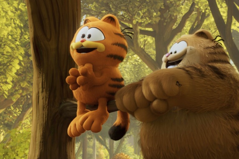 This image released by Sony Pictures shows characters Vic, voiced by Samuel L. Jackson, right, and Garfield, voiced by Chris Pratt, in a scene from the animated film "The Garfield Movie." (Columbia Pictures/Sony via AP)