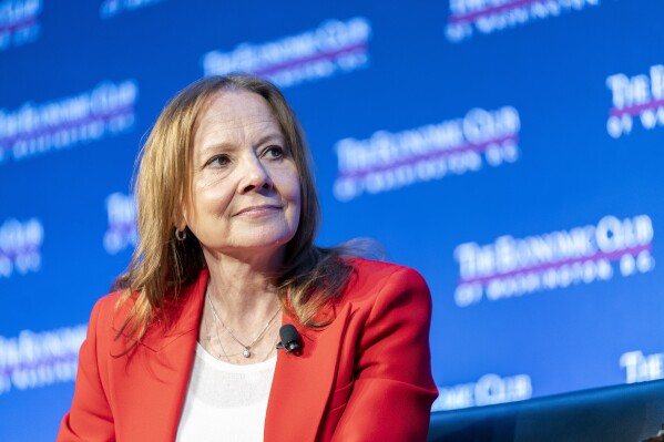 FILE- Mary Barra, chair and CEO of General Motors, talks to David Rubenstein during an interview hosted by the Economic Club of Washington, Wednesday, Dec. 13, 2023, in Washington. (AP Photo/Stephanie Scarbrough, File)