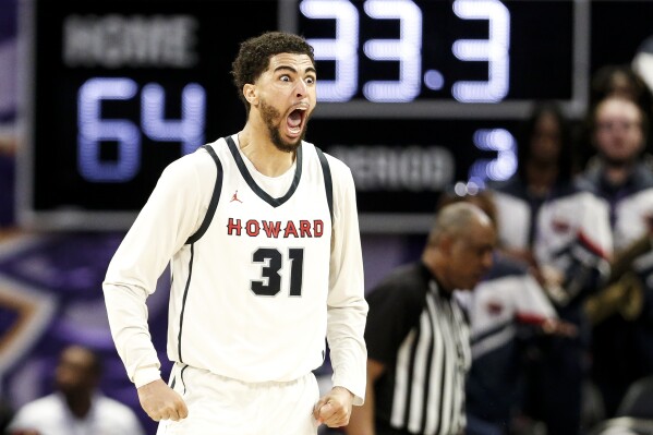 Howard Seth Towns (31) reacts to a foul against Delaware State with less than a minute left in the game. Howard defeated Delaware State 70-67 in the Mid-Eastern Athletic Conference tournament in Norfolk, Va., on Saturday, March 16, 2024. (Billy Schuerman/The Virginian-Pilot via AP)