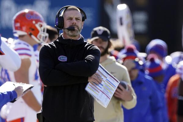 Florida head coach Billy Napier watches from the sideline in the first half of an NCAA college football game against Vanderbilt Saturday, Nov. 19, 2022, in Nashville, Tenn. (AP Photo/Mark Humphrey)