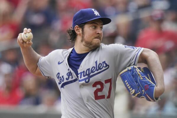 FILE -Los Angeles Dodgers starting pitcher Trevor Bauer (27) delivers in the first inning of a baseball game against the Atlanta Braves on Sunday, June 6, 2021, in Atlanta. Los Angeles prosecutors won’t charge Dodgers pitcher Trevor Bauer for allegedly beating and sexually abusing a woman he met through social media, Tuesday, Feb. 8, 2022.  (AP Photo/Brynn Anderson, File)