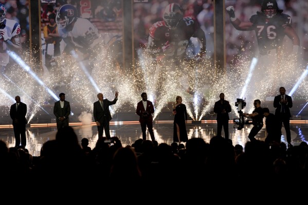 NFL Hall of Fame Class of 2024 arrives on stage during the NFL Honors award show ahead of the Super Bowl 58 football game Thursday, Feb. 8, 2024, in Las Vegas. (AP Photo/David J. Phillip)