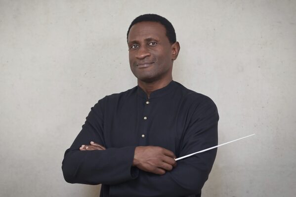 This image released by the Charlotte Symphony Orchestra shows Kwamé Ryan, who was hired as music director of the Charlotte Symphony Orchestra in North Carolina. He was given a four-year contract to start with the 2024-25 season. (Volker Renner/Charlotte Symphony Orchestra via AP)
