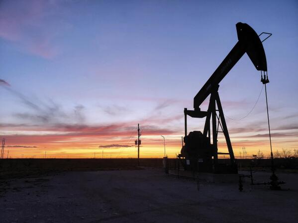 FILE - This April 8, 2020, file photo, shows a pump jack near Hobbs, N.M. The Biden administration is planning to sell oil and gas leases on huge tracts of public land in the U.S. West in coming months. (Blake Ovard/The Hobbs Daily News-Sun via AP, File)