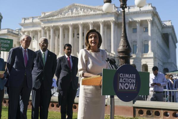 Speaker of the House Nancy Pelosi, D-Calif., and other Democratic lawmakers join activists in support of solutions to climate change as part of President Joe Biden's domestic agenda, at the Capitol in Washington, Wednesday, Oct. 20, 2021. (AP Photo/J. Scott Applewhite)