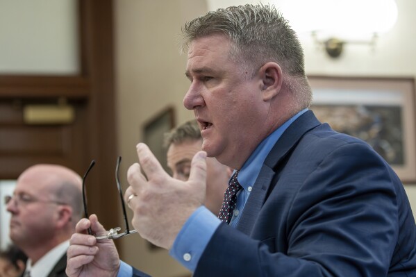 Maine State Police Col. William Ross answers questions from the Independent Commission to Investigate the Facts of the Tragedy in Lewiston during a hearing at Lewiston City Hall, Friday, May 24, 2024 in Lewiston, Maine. (Russ Dillingham /Sun Journal via AP)