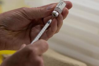 FILE - In this April 30, 2021 file photo, a pharmacist fills a syringe from a vial of the Janssen, Johnson & Johnson, COVID-19 vaccine at the Vaccine Village in Antwerp, Belgium. The U.K. has authorized for use the Johnson & Johnson vaccine. The approval of the single-dose shot comes amid growing concerns about a rise in new infections of the virus variant first identified in India. (AP Photo/Virginia Mayo, File)