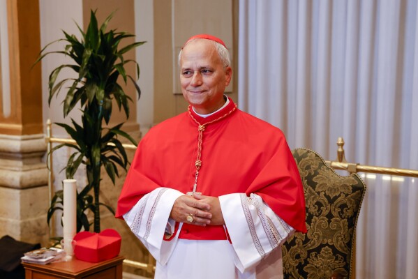 Cardinal Robert Francis Prevost, Prefect of the Dicastery for Bishops, poses for a photo at the end of the consistory where Pope Francis elevated 21 new cardinals in St. Peter's Square at The Vatican, Sept. 30, 2023. (AP Photo/Riccardo De Luca, File)